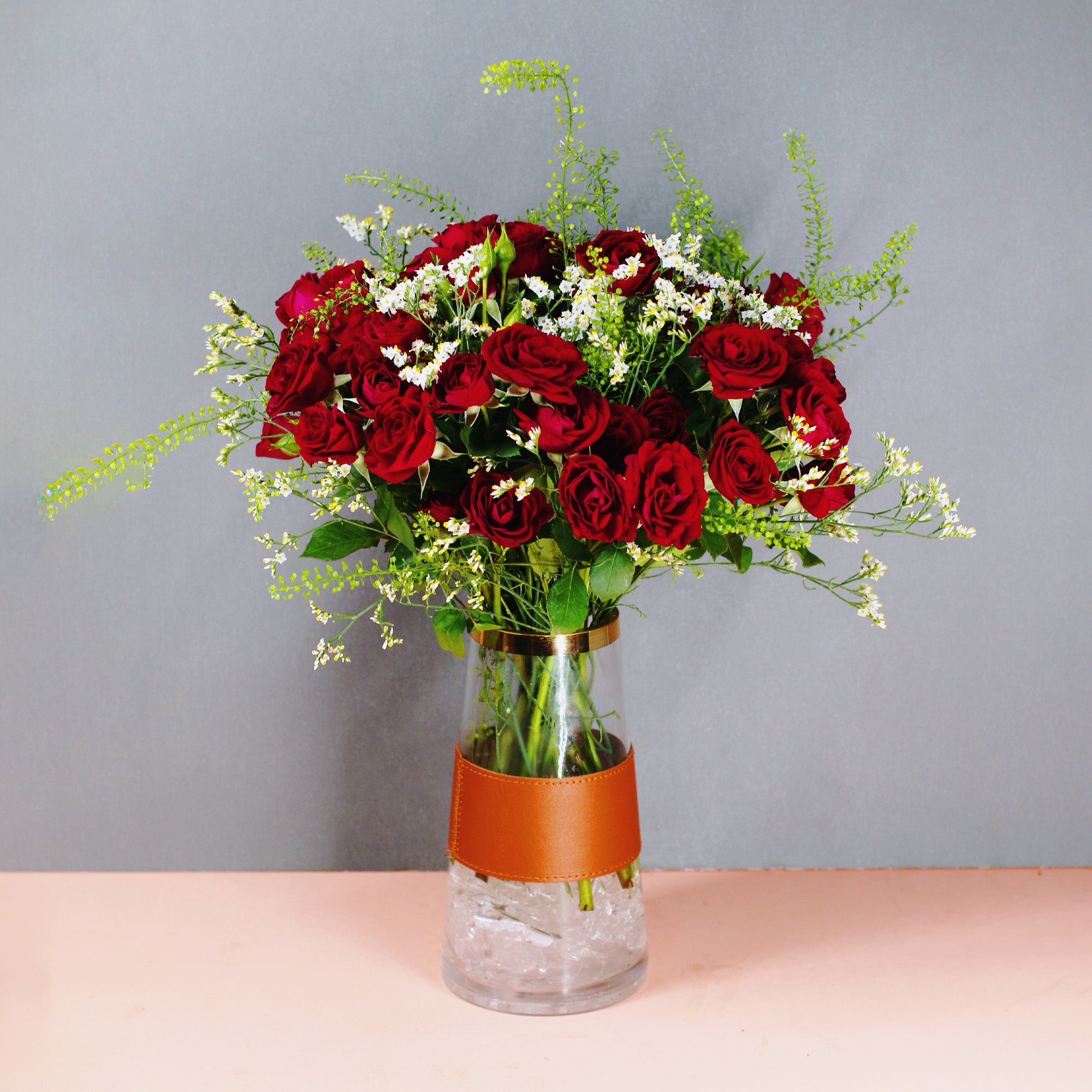 Red Roses in Glass Vase